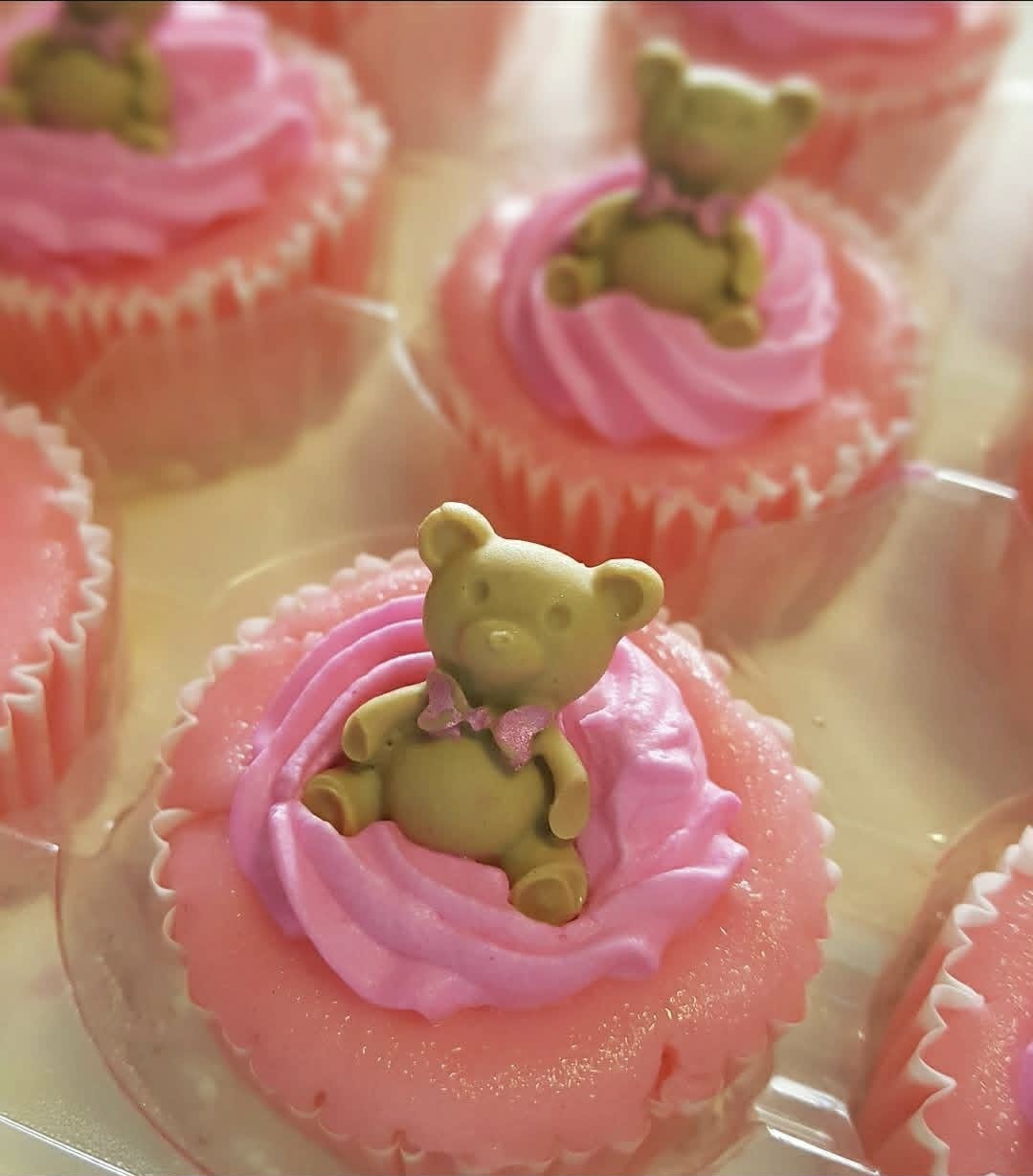 Pink raspberry mini cheesecakes with decorative toppings